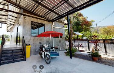 Exterior area with motorcycle and canopy