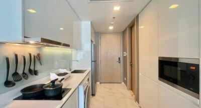 Modern kitchen with white cabinetry and stainless steel appliances