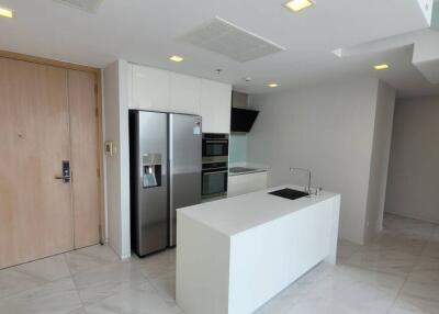 Modern kitchen with stainless steel appliances and a minimalist design