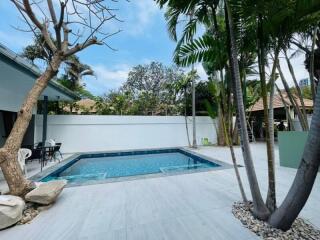 Backyard with pool and lounge area