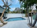 Backyard with pool and lounge area