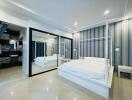 Spacious bedroom with large mirrored wardrobe and modern decor