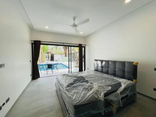 Spacious bedroom with a view of the pool