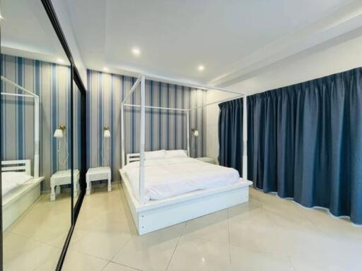 Bright and spacious bedroom with a canopy bed