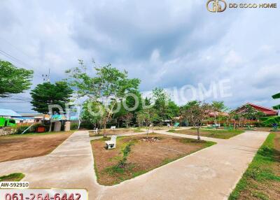 Spacious outdoor area with pathways and trees