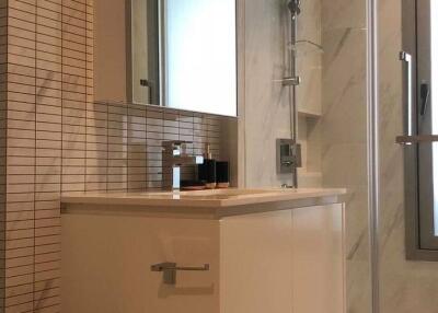 Modern bathroom with a large window and tiled walls