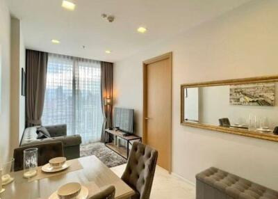 Elegant living room and dining area with natural lighting