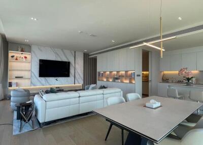 Spacious living room with modern decor and integrated kitchen