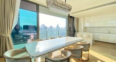 Modern dining area with large window and view of the city