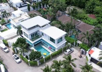Aerial view of a modern villa with a swimming pool