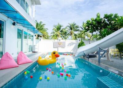 Outdoor pool area with slide