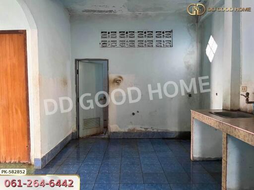 Empty kitchen with tiled floor