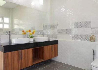 Modern bathroom with double sink and stylish tiles