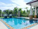 Outdoor swimming pool with a patio and greenery