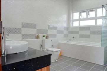 Modern bathroom with bathtub and vanity