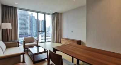 Modern living room with large window and city view