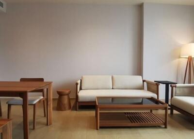 Modern living room with wooden furniture, lamp and coffee table