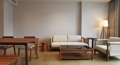 Modern living room with wooden furniture, lamp and coffee table