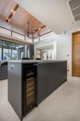 Modern kitchen with wine cooler and island
