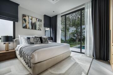 Modern bedroom with large window and outdoor view