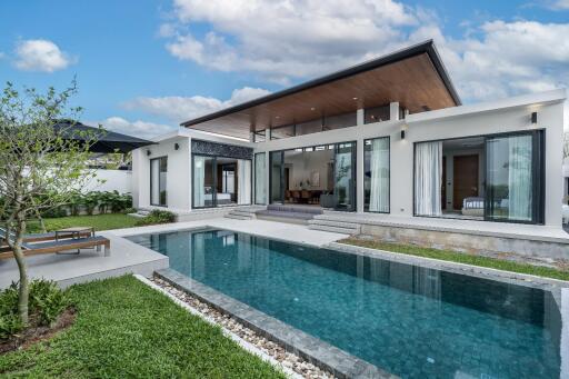 Modern house with pool and green yard