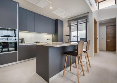 Modern kitchen with island and bar stools