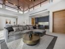 Modern living room with open kitchen and comfortable furnishings