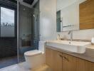Modern bathroom with glass shower and large sink