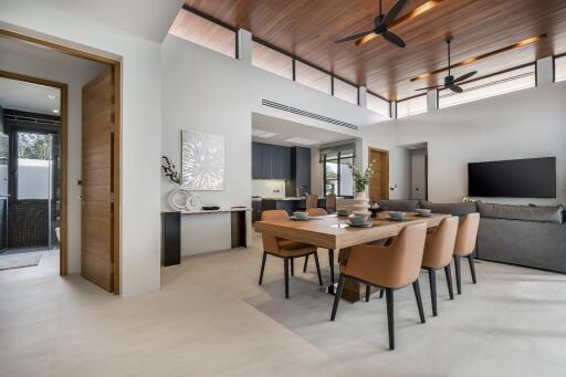Modern open-concept living and dining area with wooden ceiling and contemporary furniture