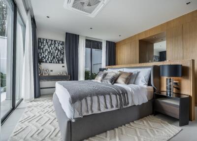 Modern bedroom with large windows and contemporary decor