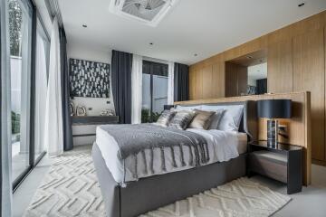 Modern bedroom with large windows and contemporary decor