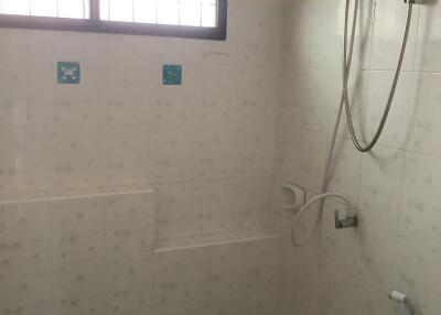 Bathroom with shower and window