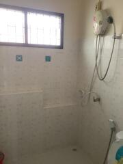 Bathroom with shower and window