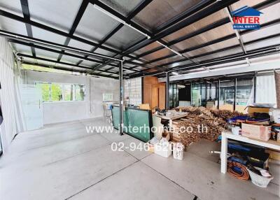 Spacious unfinished room with construction materials and large windows