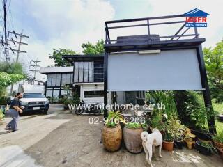 Modern two-story house exterior with driveway