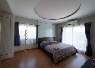 Spacious and bright bedroom with a large window