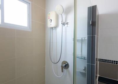 Bathroom with glass shower and window