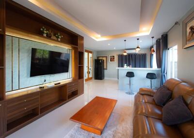 Spacious living room with modern decor and amenities