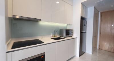 Modern kitchen with white cabinetry and appliances