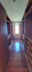 Spacious walk-in closet with ample shelving and hanging space