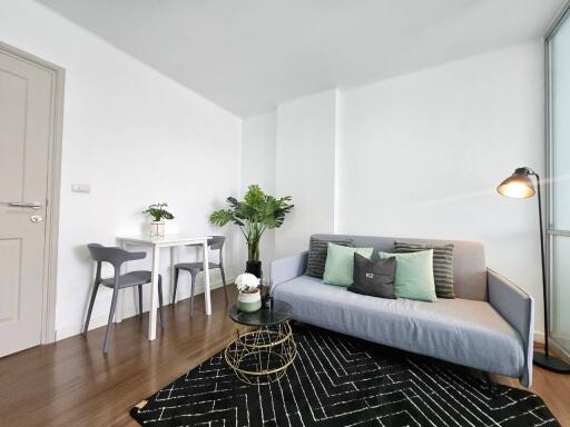 Modern living room with seating area and dining table