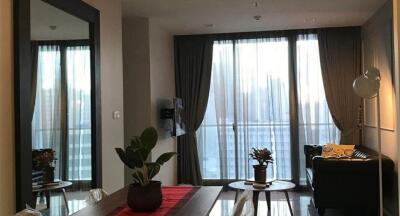 Well-lit living room with large window and balcony