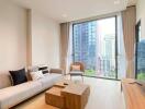 Modern living room with a sofa, chair, coffee table, and large windows offering city views