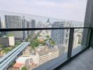 Balcony view overlooking cityscape with modern buildings