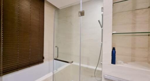 Modern bathroom with glass shower and wooden blinds