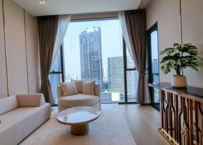 well-lit living room with modern furniture and city view