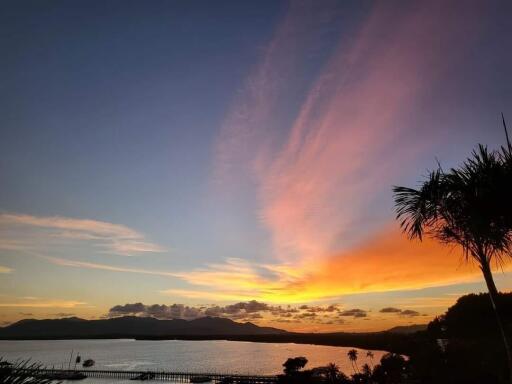 Beautiful sunset view over a water body with mountains in the background