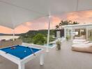 Rooftop terrace with pool table and seating area