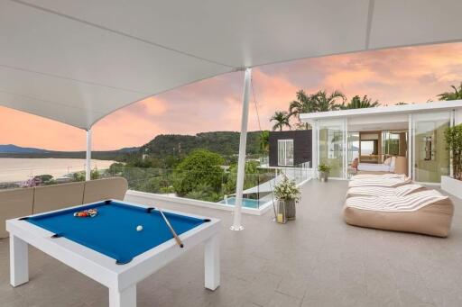 Rooftop terrace with pool table and seating area
