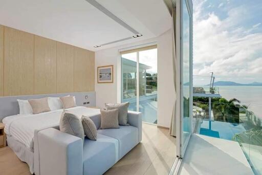 Modern bedroom with ocean view and large windows